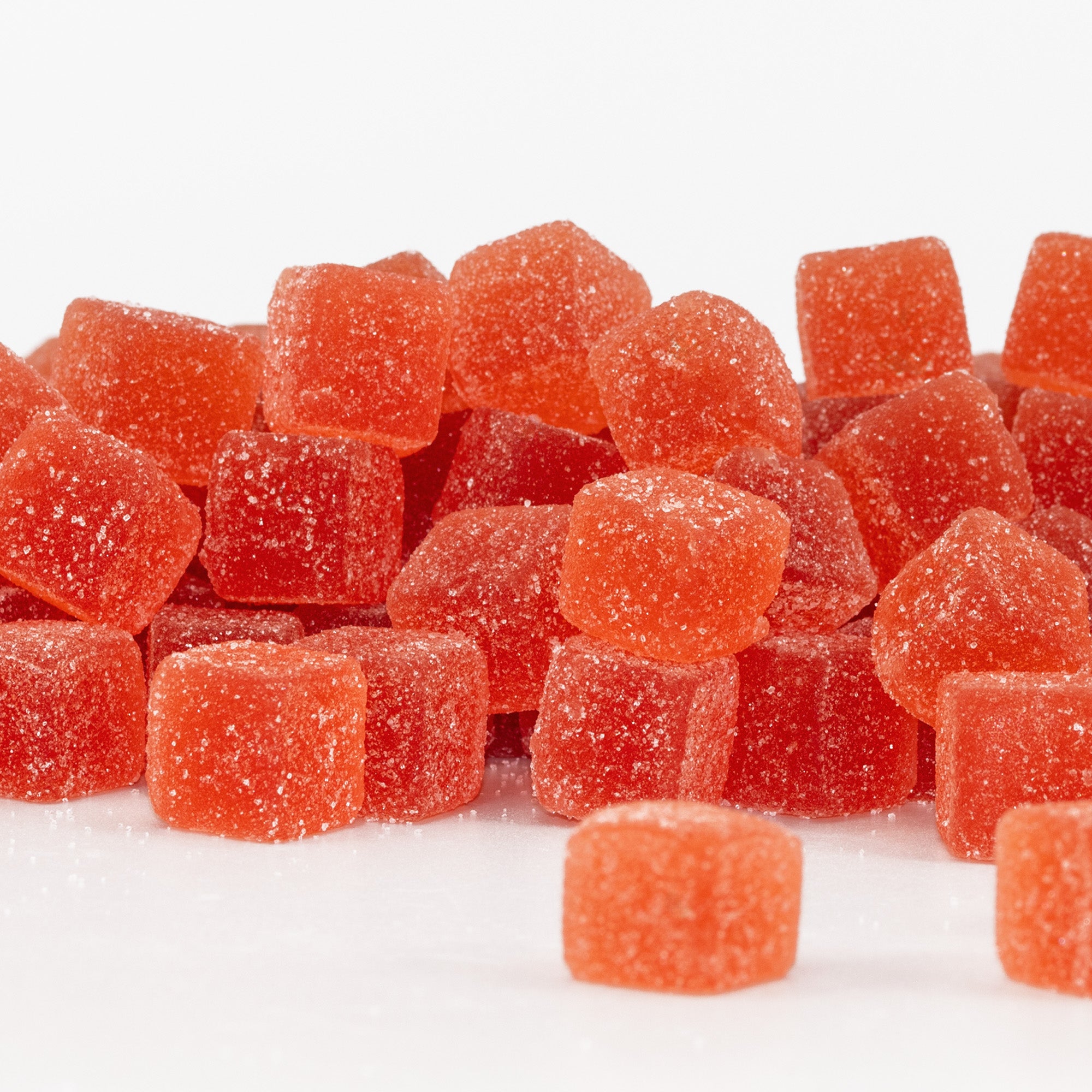 Grapefruit Tangerine gummy candies on a white background