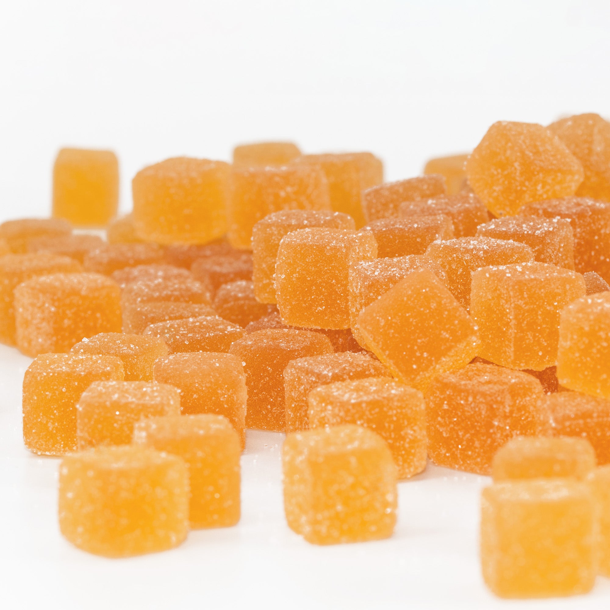 Mango Apricot gummy candies on a white background